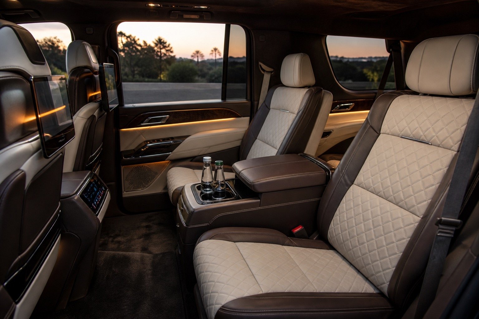 Rear seating area of a Cadillac Escalade with headrests and climate controls