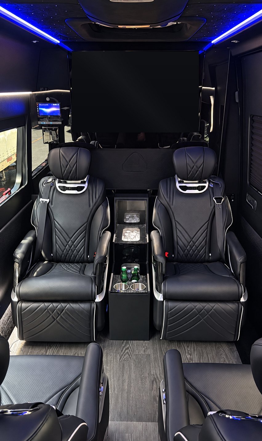 Jet Sprinter, Los Angeles — face-to-face VIP captain's chairs with a chilled drinks console