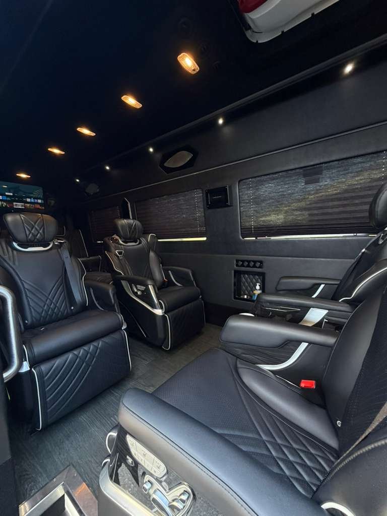 Lux 10+1 Sprinter side view exterior - black luxury van rental LA
